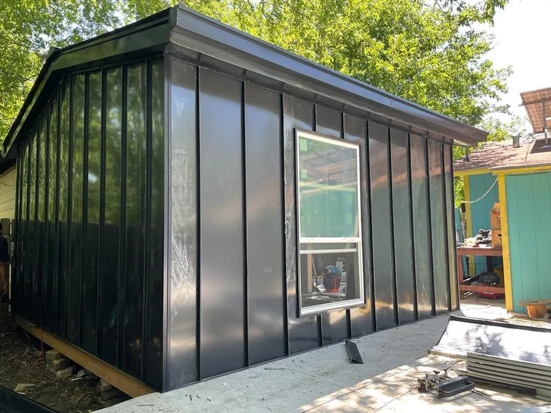Black standing seam metal wall panels for Roof Inspection in North Lakes