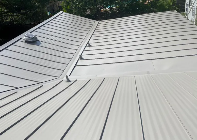 Solar attic fan installed on a metal roof for Roof Ventilation in North Lakes